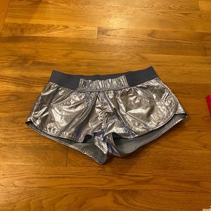 Shiny athletic shorts.